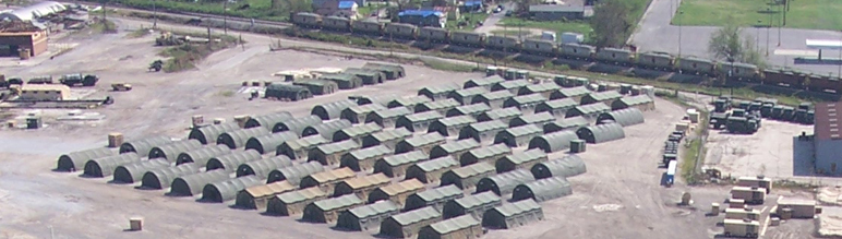 Aerial view of army tents and trucks.