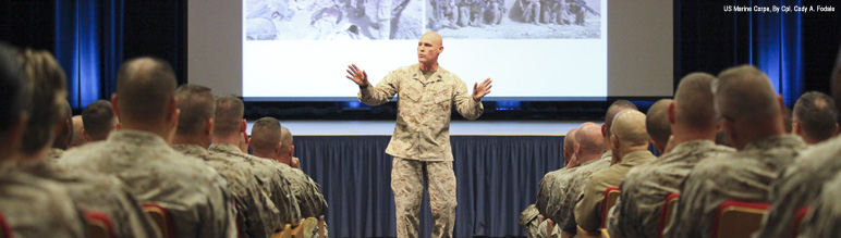 A Sergeant Major speaks to Marine officers and staff noncommisioned officers.